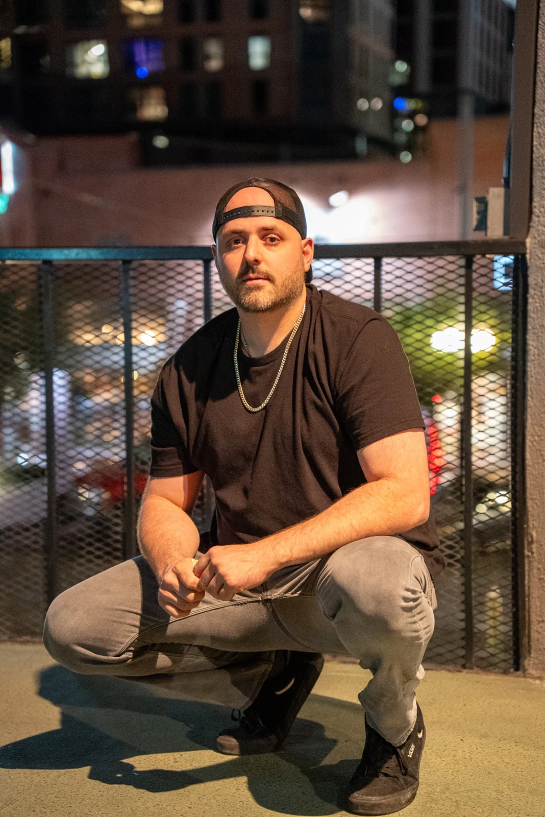 Portrait of PHAZIX wearing a backwards cap and black shirt
